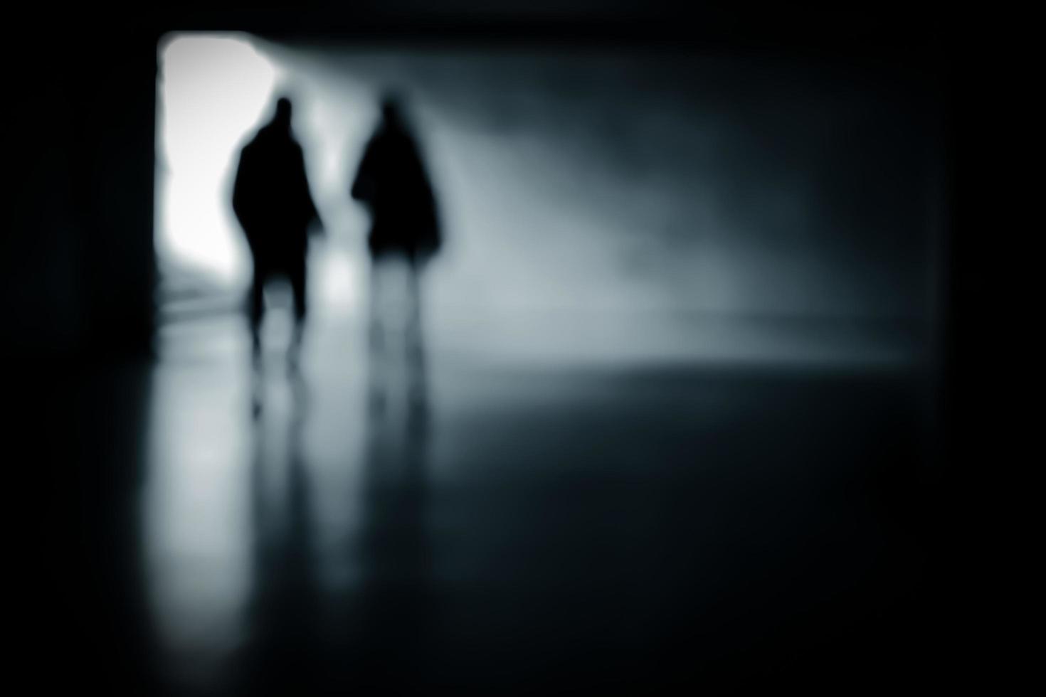 blurry-moving-silhouettes-in-an-underground-passage-free-photo.jpg